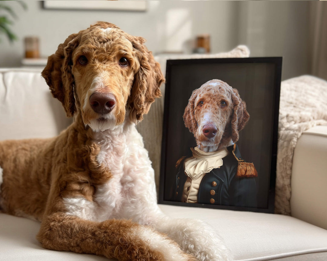 A goldendoodle sitting on a couch next to a framed custom pet portrait depicting it as a Renaissance noble.